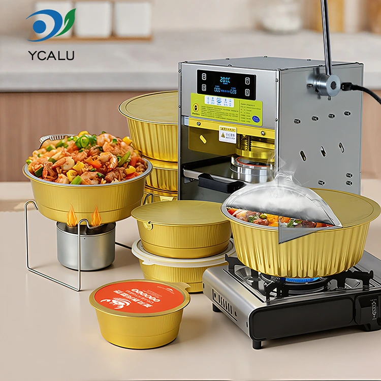 Macchina termosaldatrice manuale con contenitori in foglio di alluminio dorato